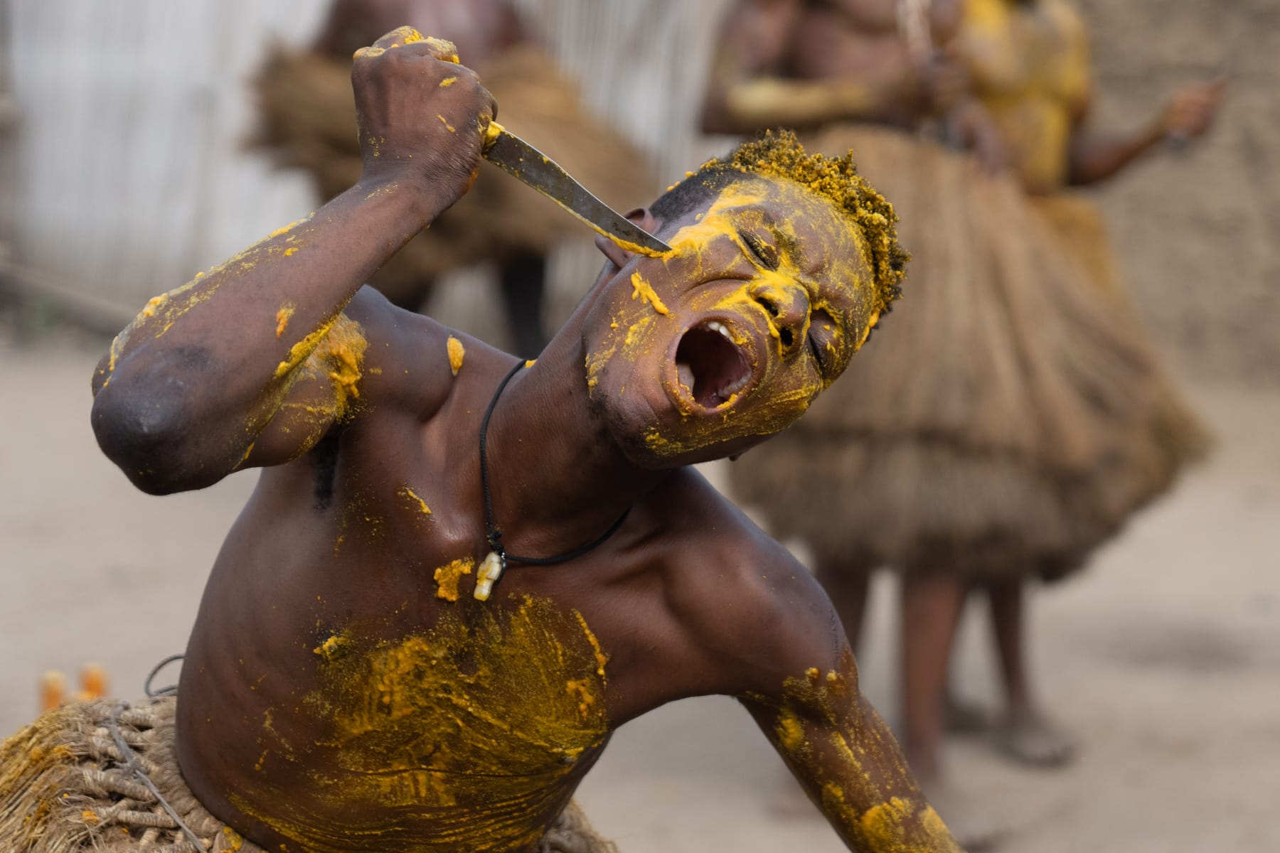 Local musicians playing the bata drum at a Benin ceremony