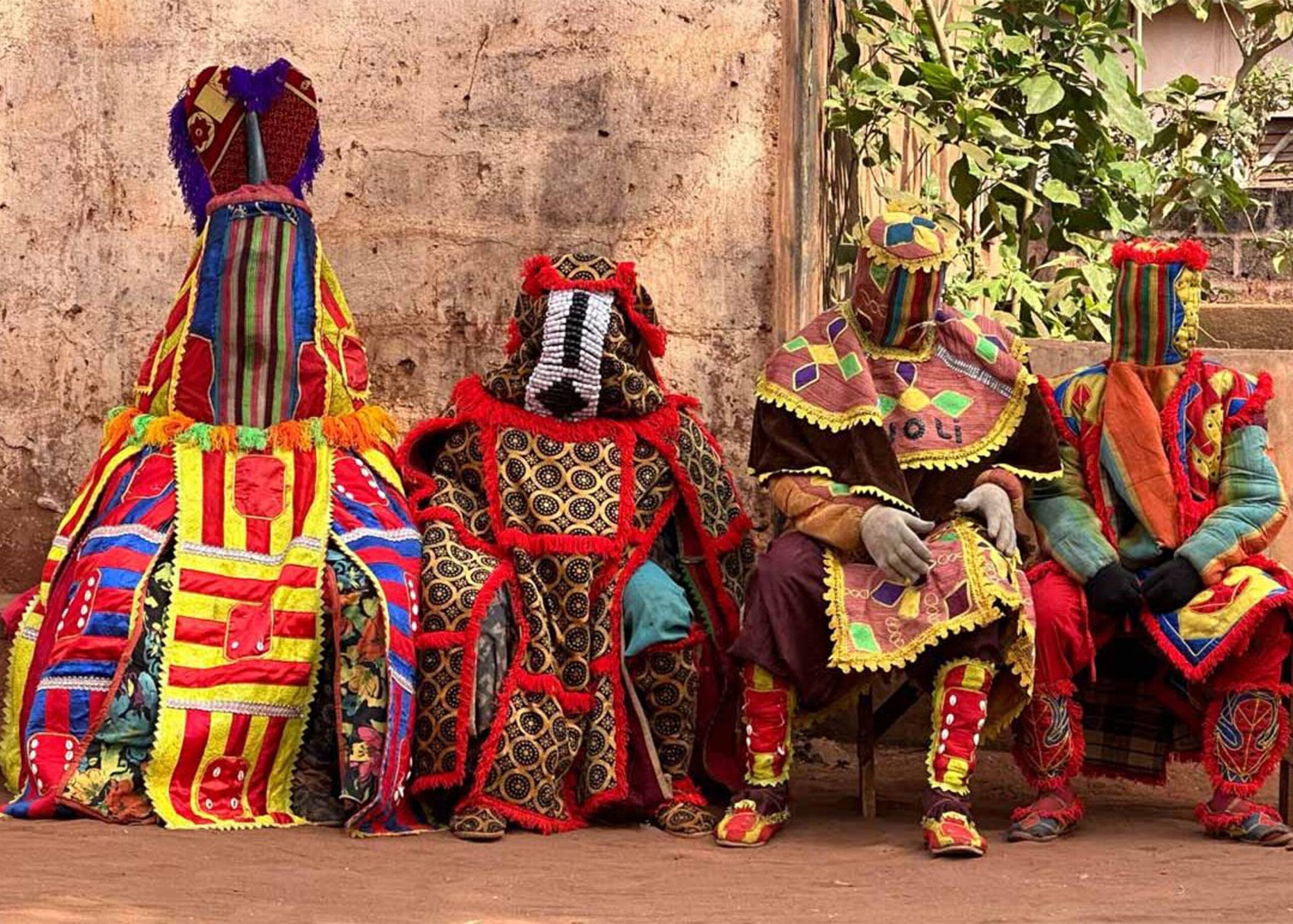 Beninese dancer in traditional raffia costume during festival