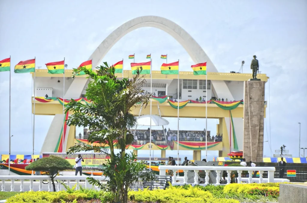 Ghana Independence Arch at Black Star Square in Accra, draped with national flags.