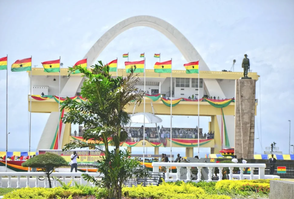 Ghana Independence Arch at Black Star Square in Accra, draped with national flags.