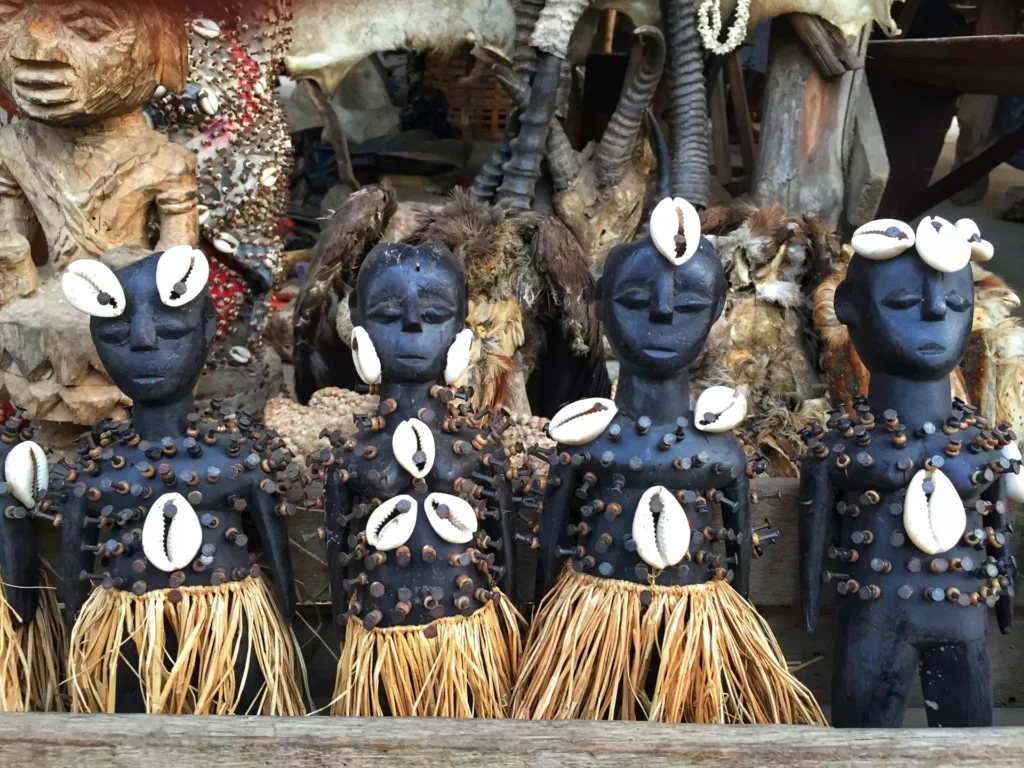 Voodoo fetish figures with cowrie-shell eyes in Benin