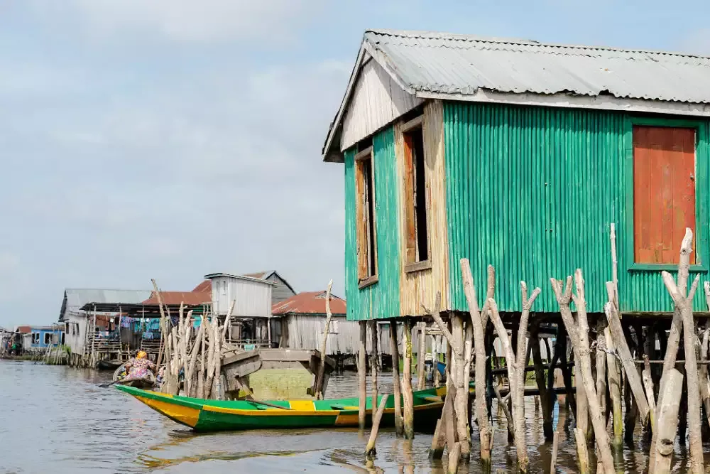 Colorful stilt house over the water at Lake Togo