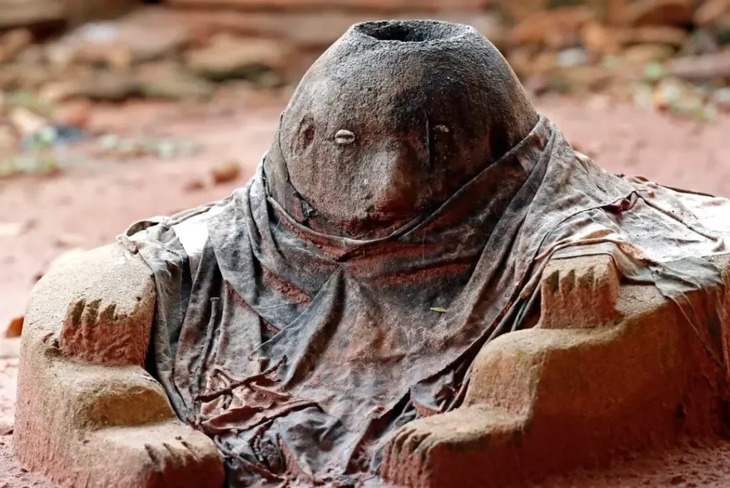 Carved Legba voodoo protection figure in Togo